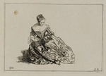 Auf dem Boden sitzende junge Frau